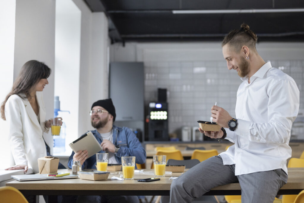 colleagues in a corporate cafeteria consulting