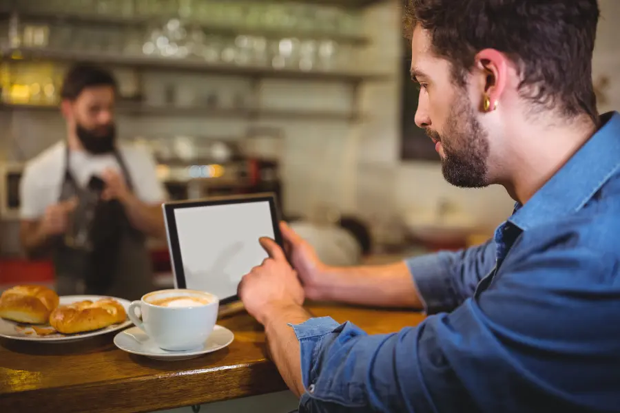 man looking at a digital restaurant menu