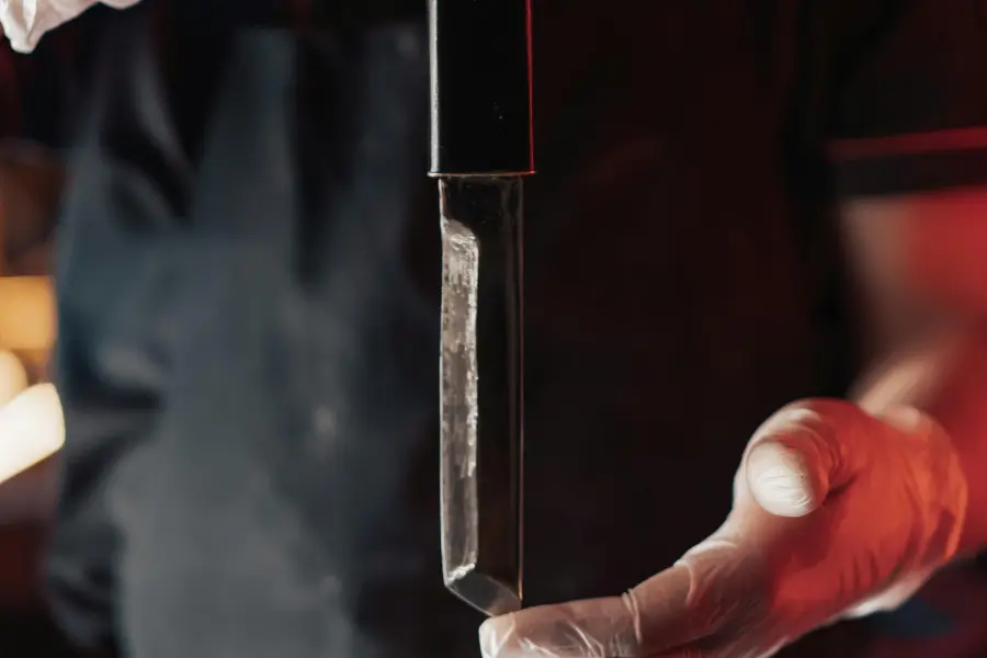 A chef holding a kitchen knife