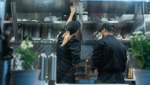 2 people working in the kitchen