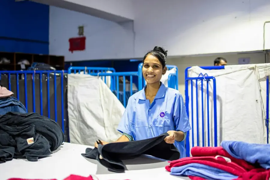 Lundry staff folding clothes