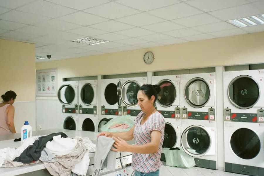 Laundry staff working in the laundry department.
