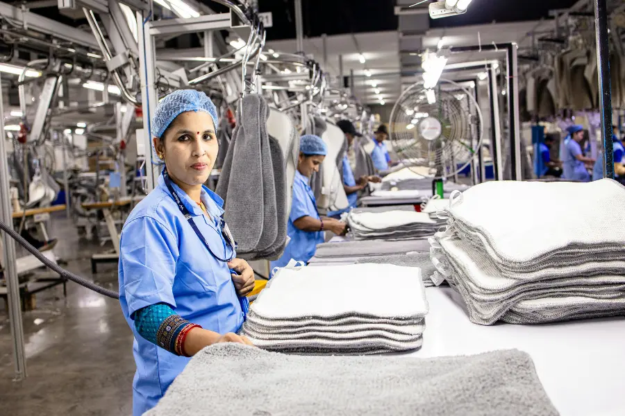 Ladies working in a laundry roomof a hotel.