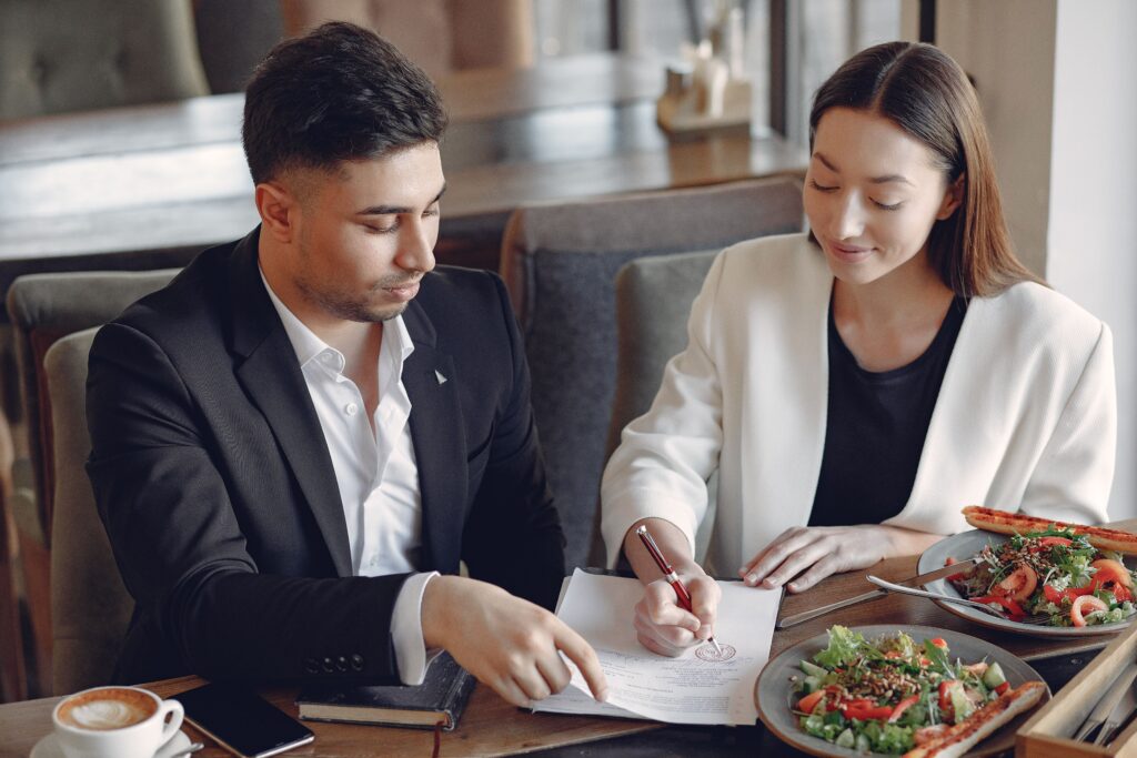 Food and beverage consultant reviewing commercial kitchen equipment layout for a hotel