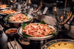 A fully operational hotel buffet with hot and cold stations, showing smooth replenishment and controlled service supported by strategic food and beverage consultant kitchen planning.